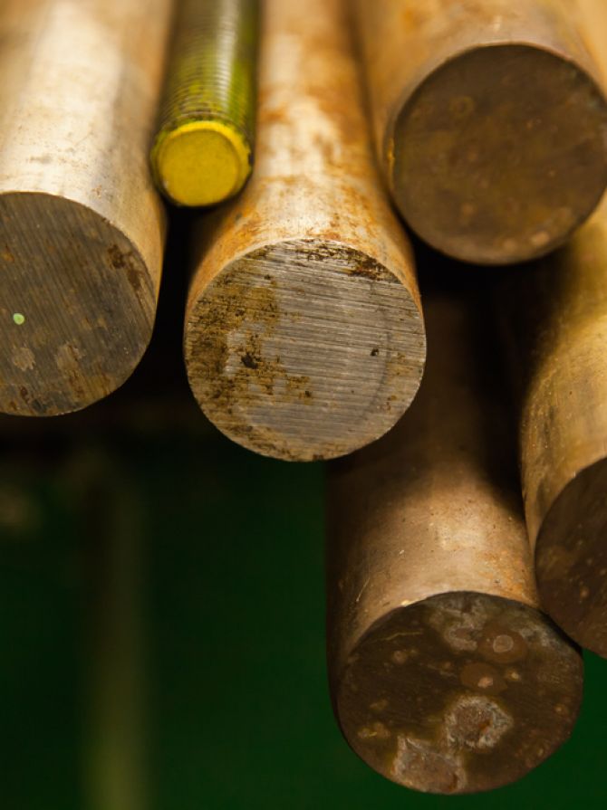 Large-sized,Bronze,Round,Bars,Lie,On,The,Shelf,,Close-up.