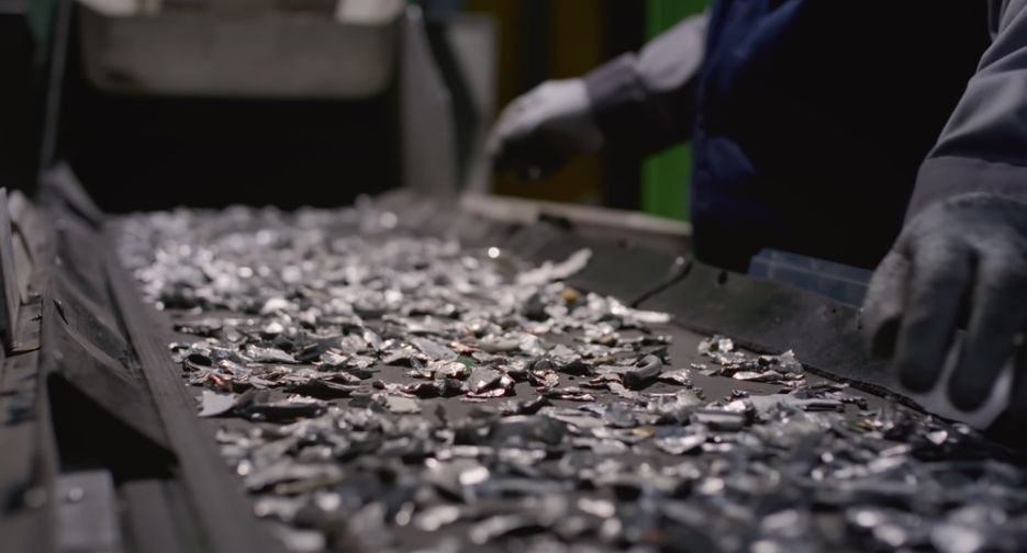 Worker,Sorts,Trash,On,Conveyor,Belt,At,Waste,Recycling,Plant.