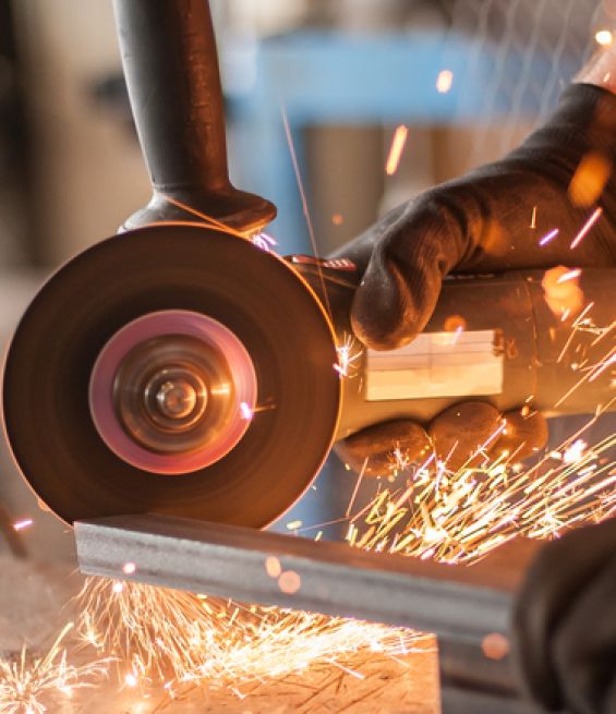 Electric,Wheel,Grinding,On,Steel,Structure,In,Factory.,Sparks,From